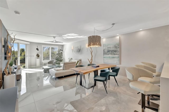 dining space with ceiling fan