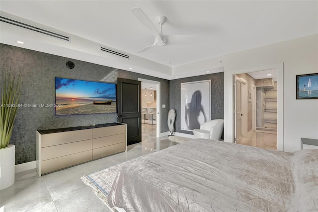 bedroom featuring a closet, ceiling fan, and ensuite bathroom