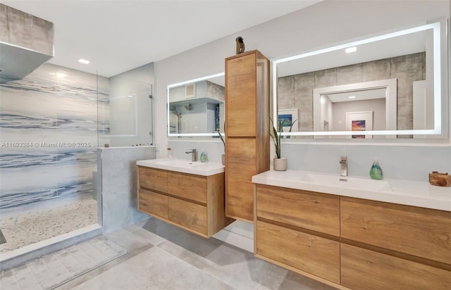 bathroom featuring vanity and a tile shower