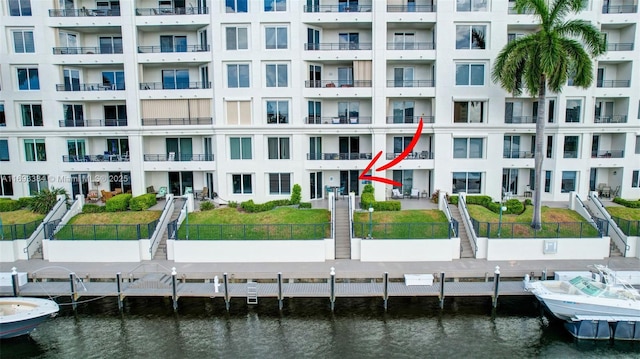 exterior space featuring a dock and a water view