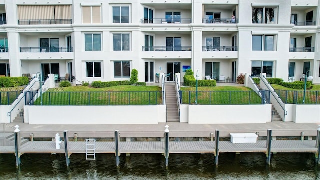 exterior space with a dock and a water view