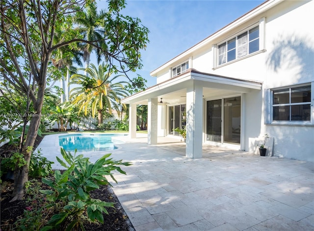 view of pool featuring ceiling fan and a patio area