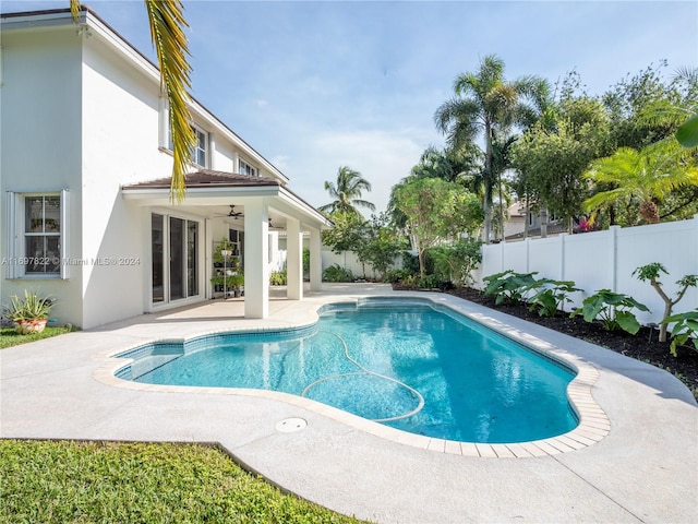 view of pool featuring ceiling fan and a patio