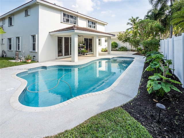 view of swimming pool featuring a patio area