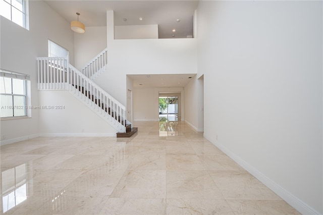 foyer featuring a high ceiling