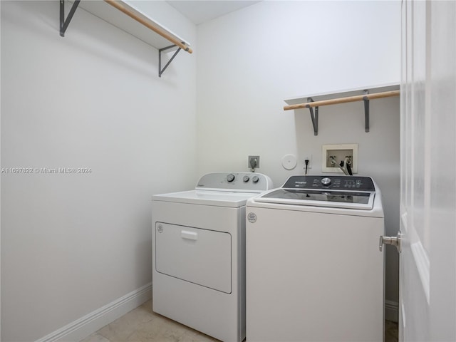 washroom with washer and dryer