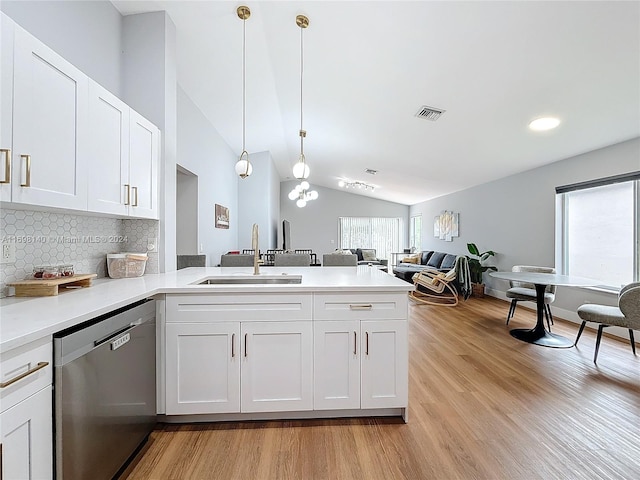 kitchen featuring dishwasher, white cabinets, pendant lighting, and sink