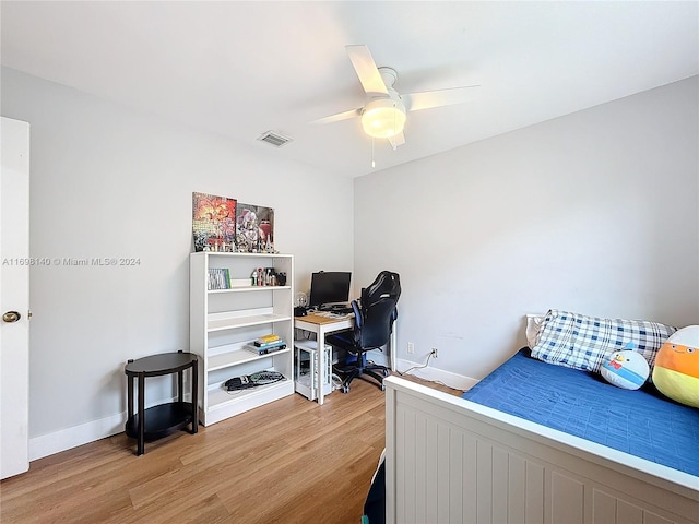 bedroom featuring hardwood / wood-style floors and ceiling fan