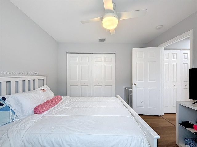 bedroom featuring ceiling fan, a closet, and dark hardwood / wood-style floors