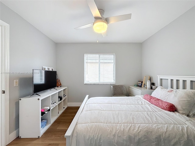 bedroom featuring ceiling fan and hardwood / wood-style floors