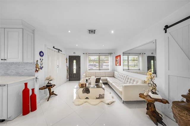 1458 Rodman St, Hollywood, FL 33020 - living area with a barn door, recessed lighting, and light tile patterned flooring