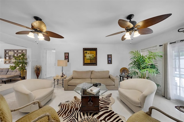 living room with ceiling fan, light tile patterned floors, and a healthy amount of sunlight