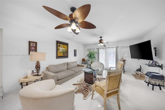 tiled living room with ceiling fan