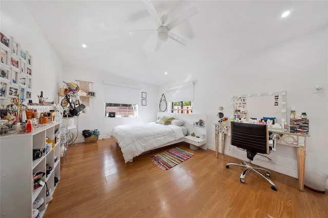 bedroom with ceiling fan and hardwood / wood-style floors