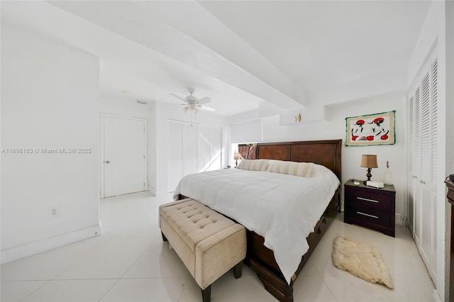 bedroom with ceiling fan and light tile patterned flooring