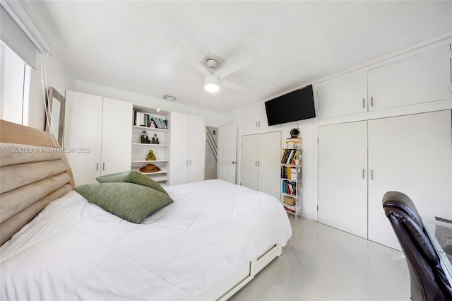 bedroom featuring ceiling fan and light tile patterned flooring