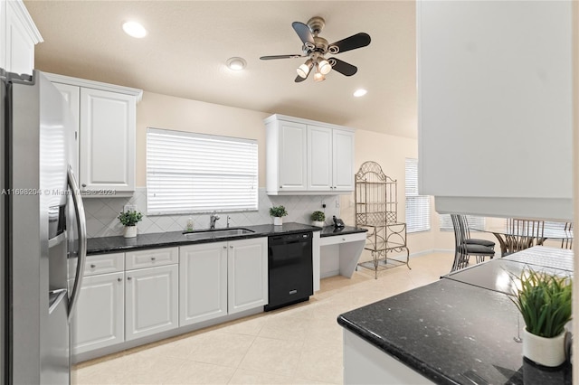 kitchen featuring white cabinetry, dishwasher, sink, backsplash, and stainless steel fridge