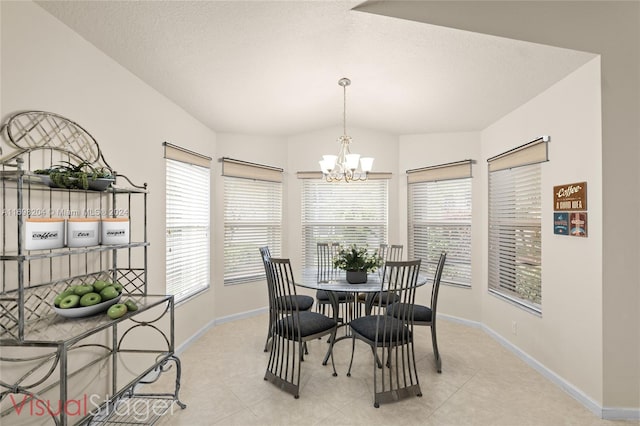 tiled dining area with a textured ceiling, vaulted ceiling, and a notable chandelier