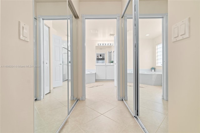 corridor with light tile patterned floors