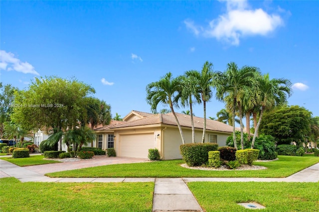 view of front facade featuring a garage and a front yard