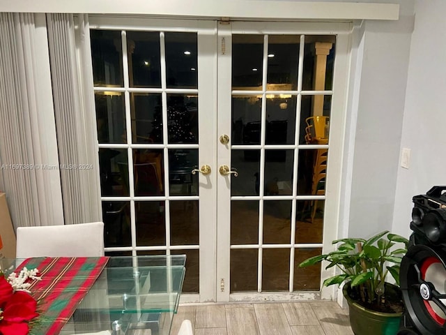 doorway to outside featuring wood-type flooring and french doors