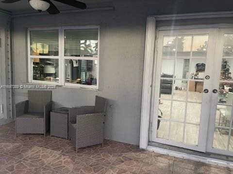 exterior space with ceiling fan, a patio, and french doors