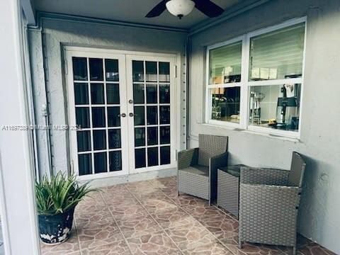 view of patio with ceiling fan and french doors