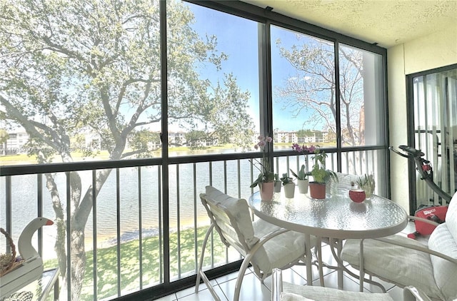 sunroom with a water view