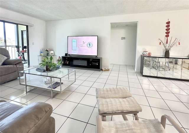 living room featuring light tile patterned floors and a textured ceiling