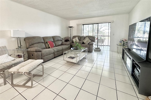 living room featuring a textured ceiling and light tile patterned floors