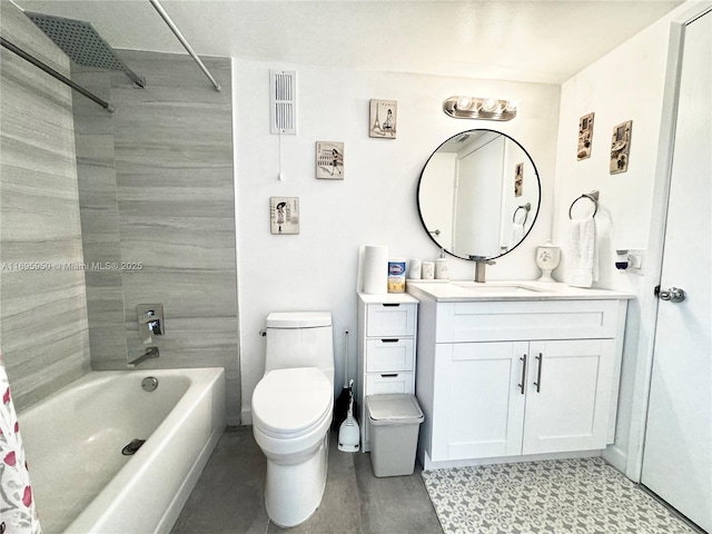 full bathroom with toilet, tiled shower / bath, and vanity