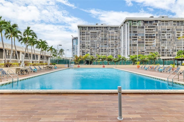 view of swimming pool with a patio