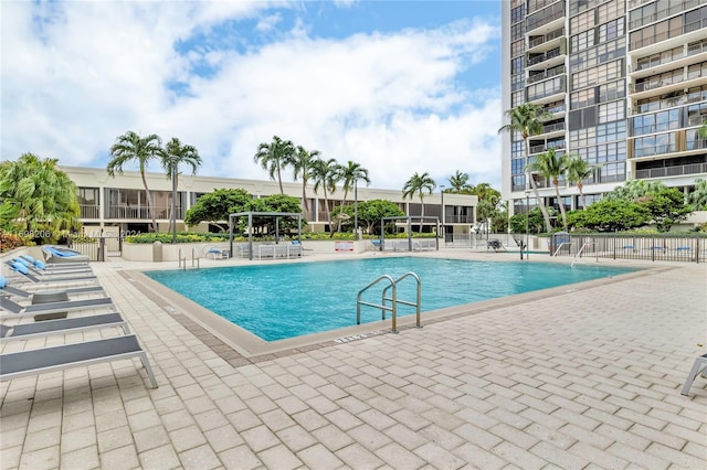 view of swimming pool with a patio area