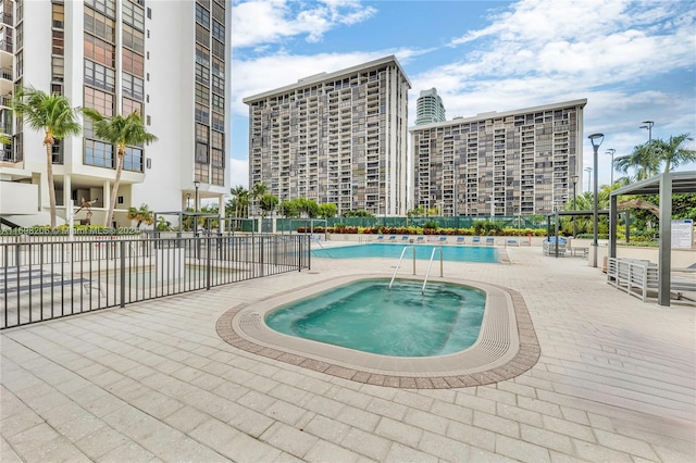 view of swimming pool with a patio