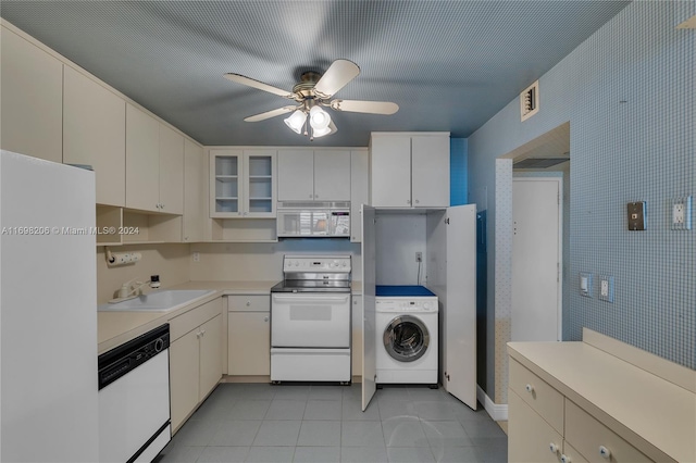 kitchen featuring white cabinetry, ceiling fan, sink, washer / clothes dryer, and white appliances