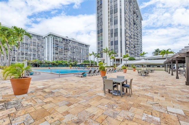 view of swimming pool featuring a patio area