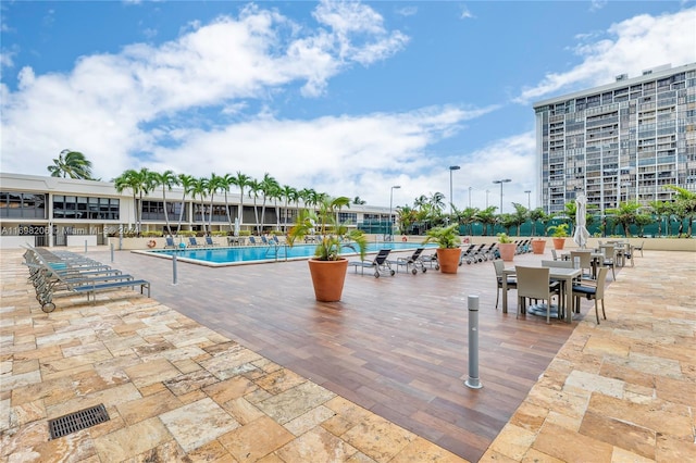 view of swimming pool with a patio area