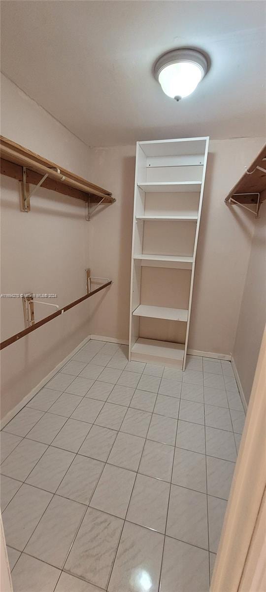 walk in closet featuring light tile patterned floors