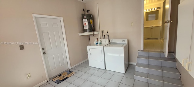 laundry area with separate washer and dryer, light tile patterned floors, and water heater