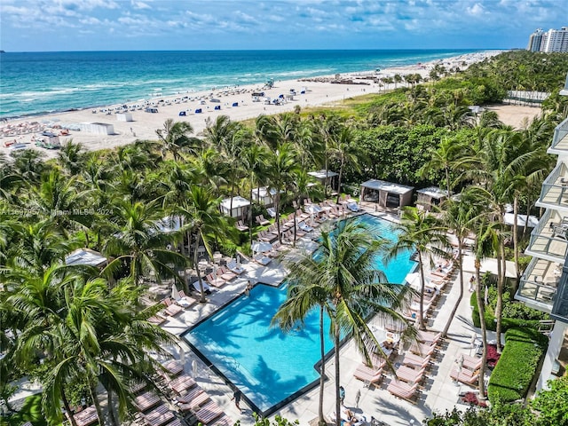 bird's eye view with a water view and a view of the beach