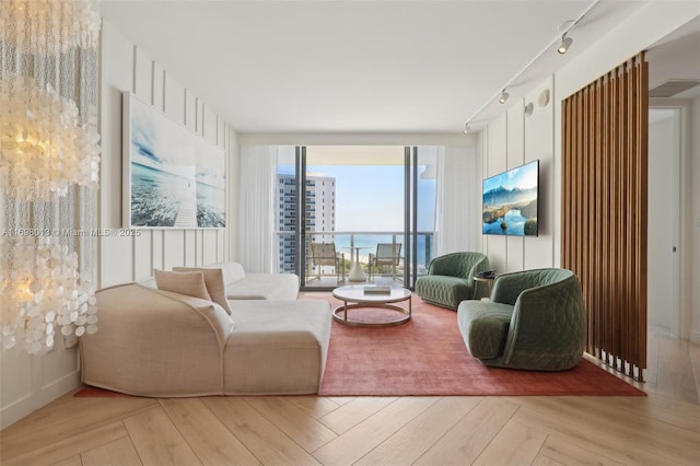 2201 Collins Ave Unit 1015, Miami Beach, FL 33139 - living room with track lighting and a wall of windows