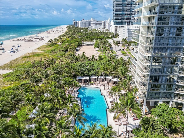 exterior space featuring a beach view and a water view