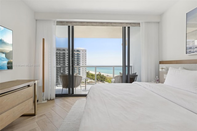 2201 Collins Ave Unit 1015, Miami Beach, FL 33139 - bedroom featuring a water view and access to outside