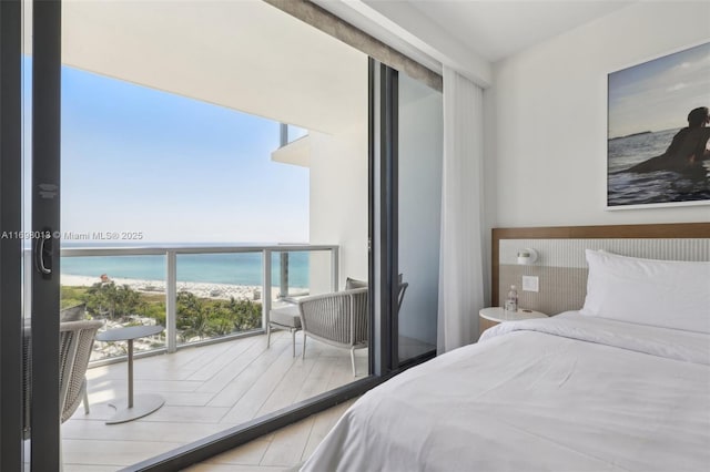 2201 Collins Ave Unit 1015, Miami Beach, FL 33139 - bedroom with view of water and beach and expansive windows
