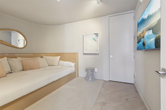2201 Collins Ave Unit 1015, Miami Beach, FL 33139 - bedroom featuring light wood-style flooring and baseboards