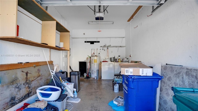 garage featuring washing machine and clothes dryer, a garage door opener, and water heater