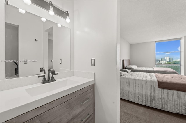 bathroom with a view of city, vanity, and ensuite bathroom