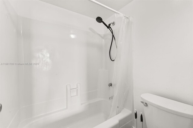 2350 NE 135th St Unit 1401, North Miami, FL 33181 - bathroom featuring toilet and shower / bathtub combination with curtain