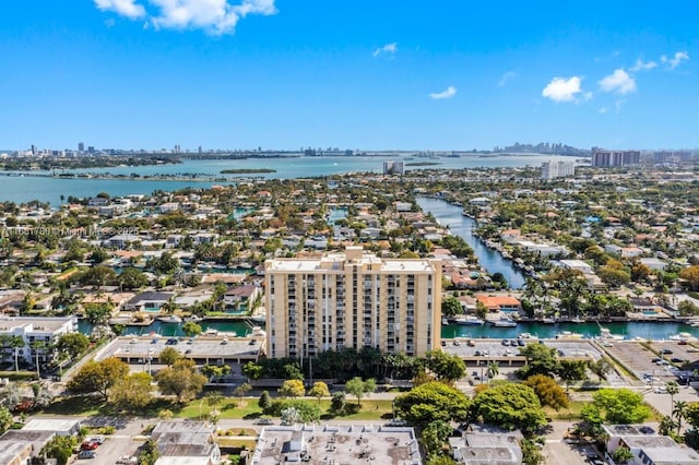 aerial view featuring a city view and a water view