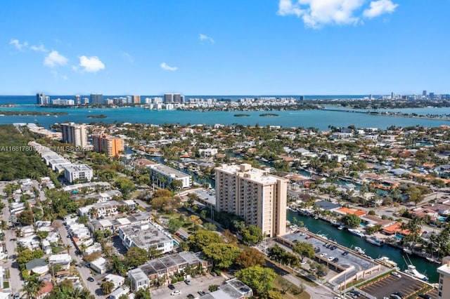 birds eye view of property featuring a view of city and a water view